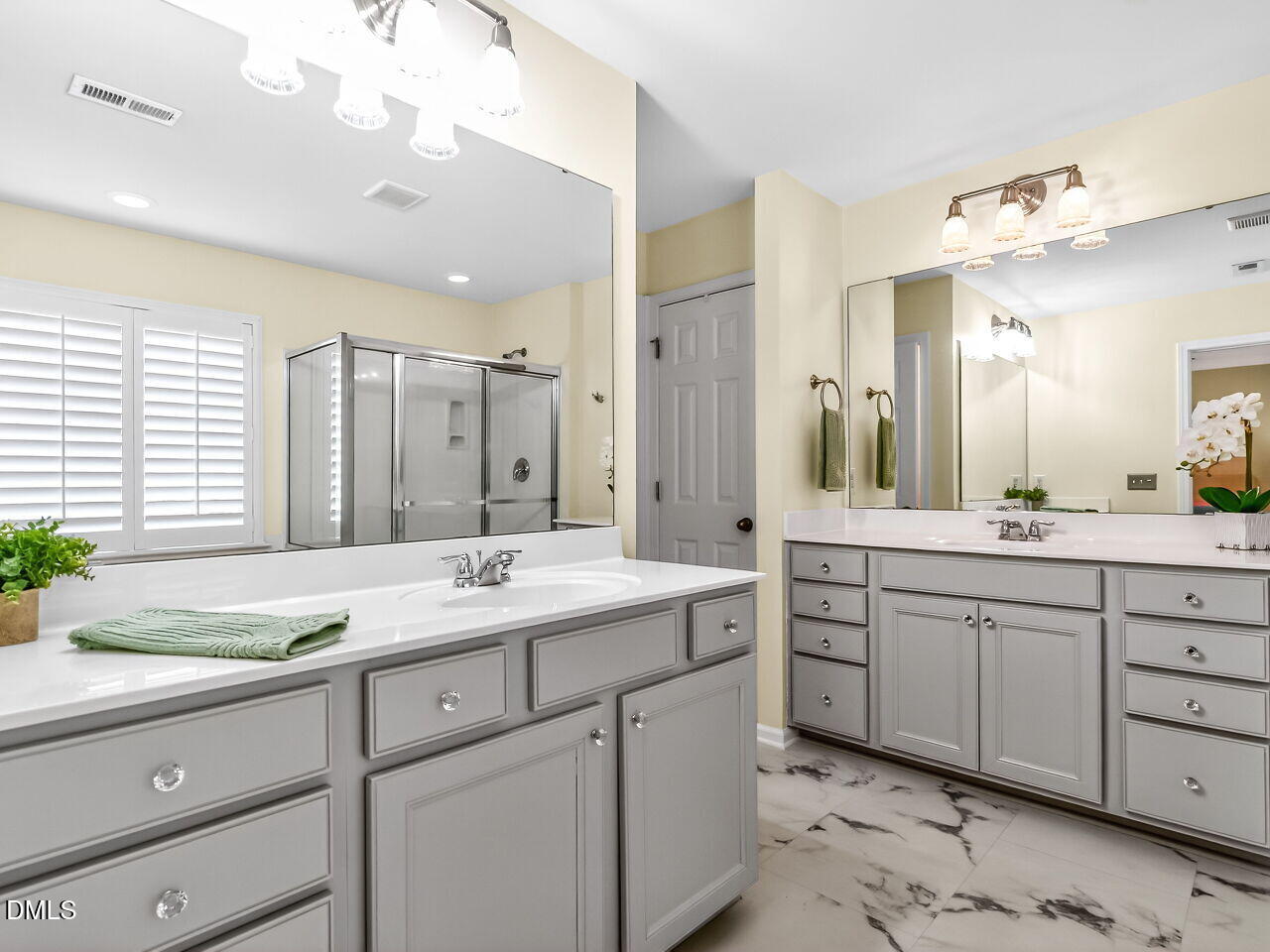 2512 Blooming Street Raleigh, NC 27612 - Photo 24 of 33 a bathroom with a sink double vanity and a mirror