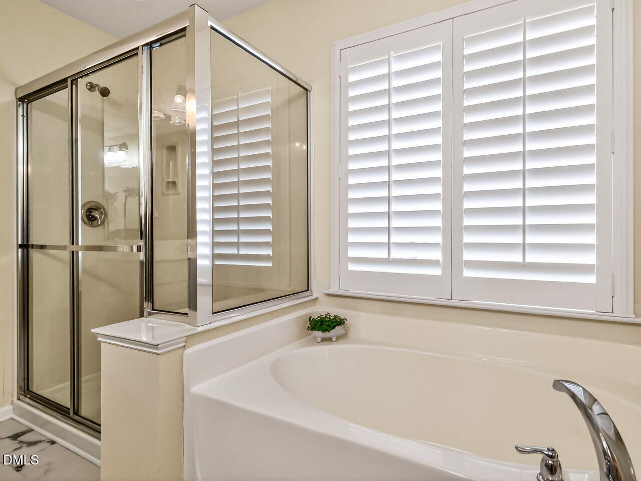 2512 Blooming Street Raleigh, NC 27612 - Photo 25 of 33 a bathroom with a bathtub and a shower