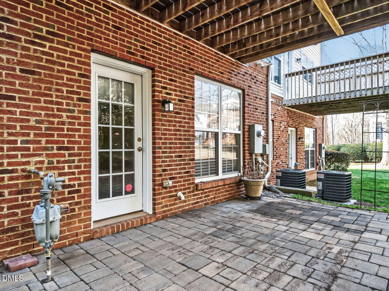2512 Blooming Street Raleigh, NC 27612 - Photo 32 of 33 a view of a brick house with a large window