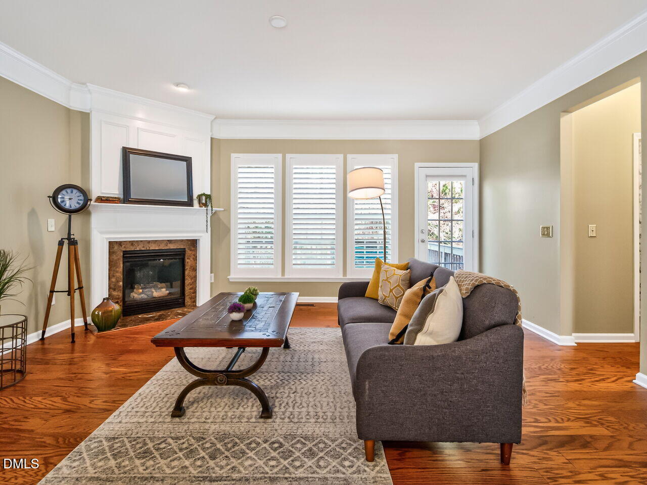 2512 Blooming Street Raleigh, NC 27612 - Photo 6 of 33 a living room with furniture and a fireplace