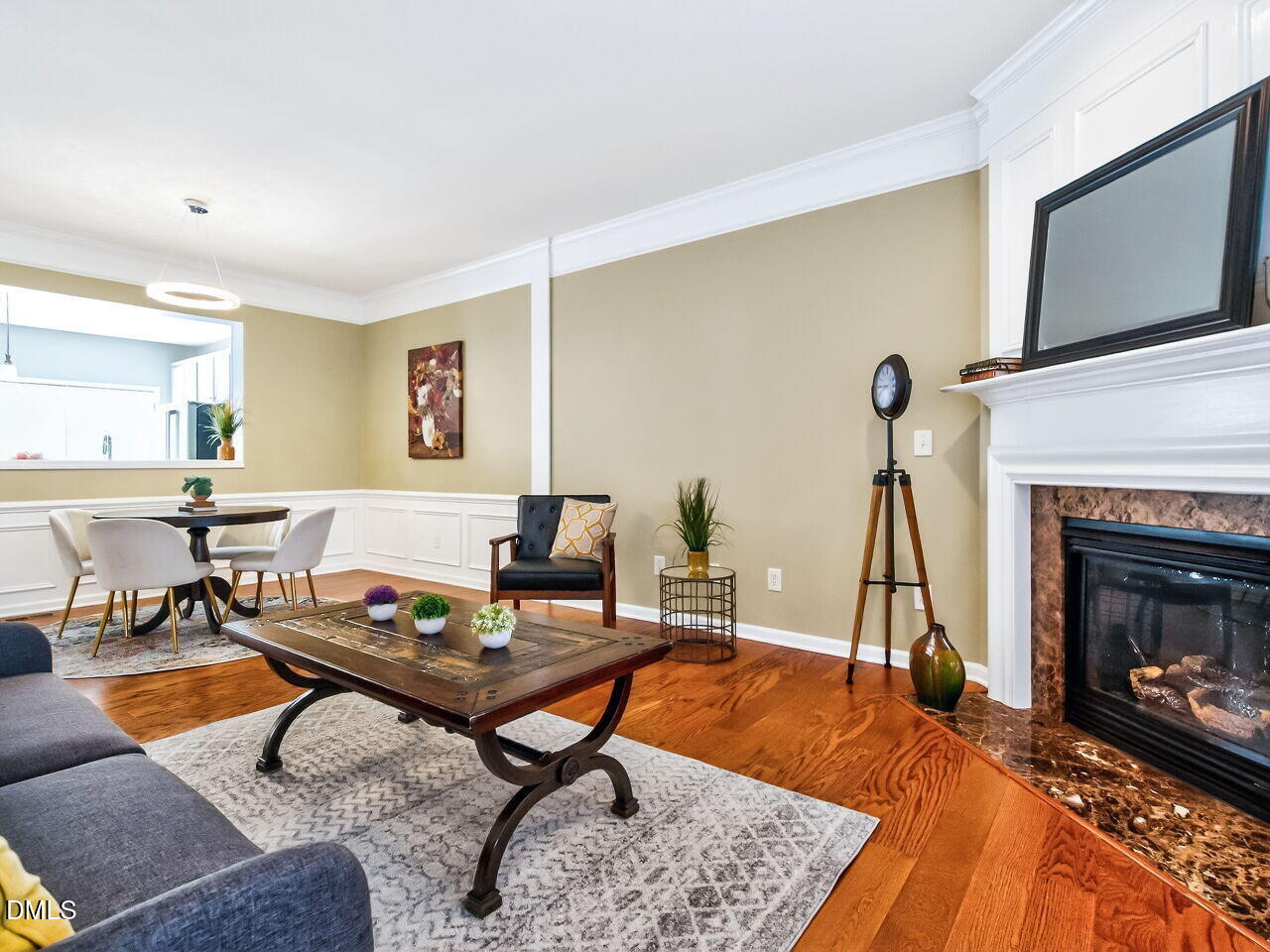 2512 Blooming Street Raleigh, NC 27612 - Photo 9 of 33 a living room with furniture a rug and a fireplace