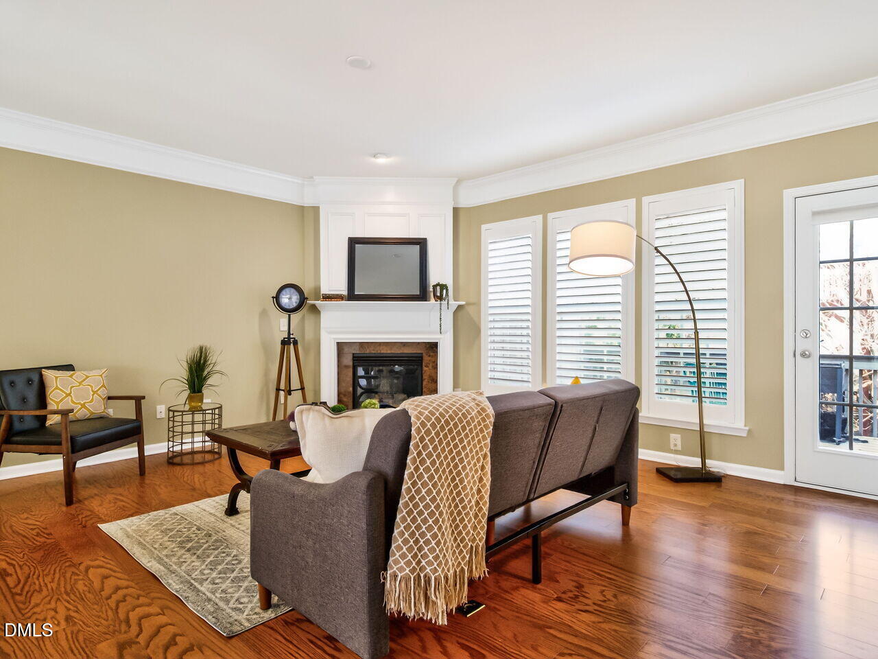 2512 Blooming Street Raleigh, NC 27612 - Photo 10 of 33 a living room with furniture a fireplace and a table
