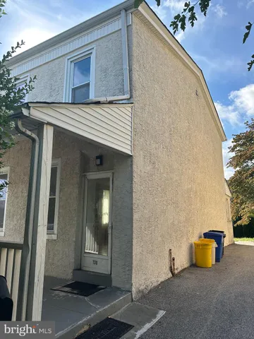 a view of a house with entrance gate