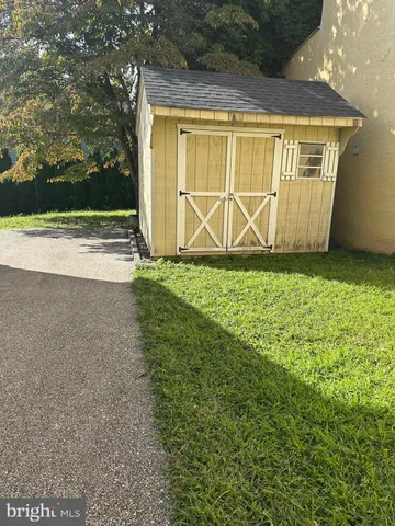 a view of a house with a yard and garage