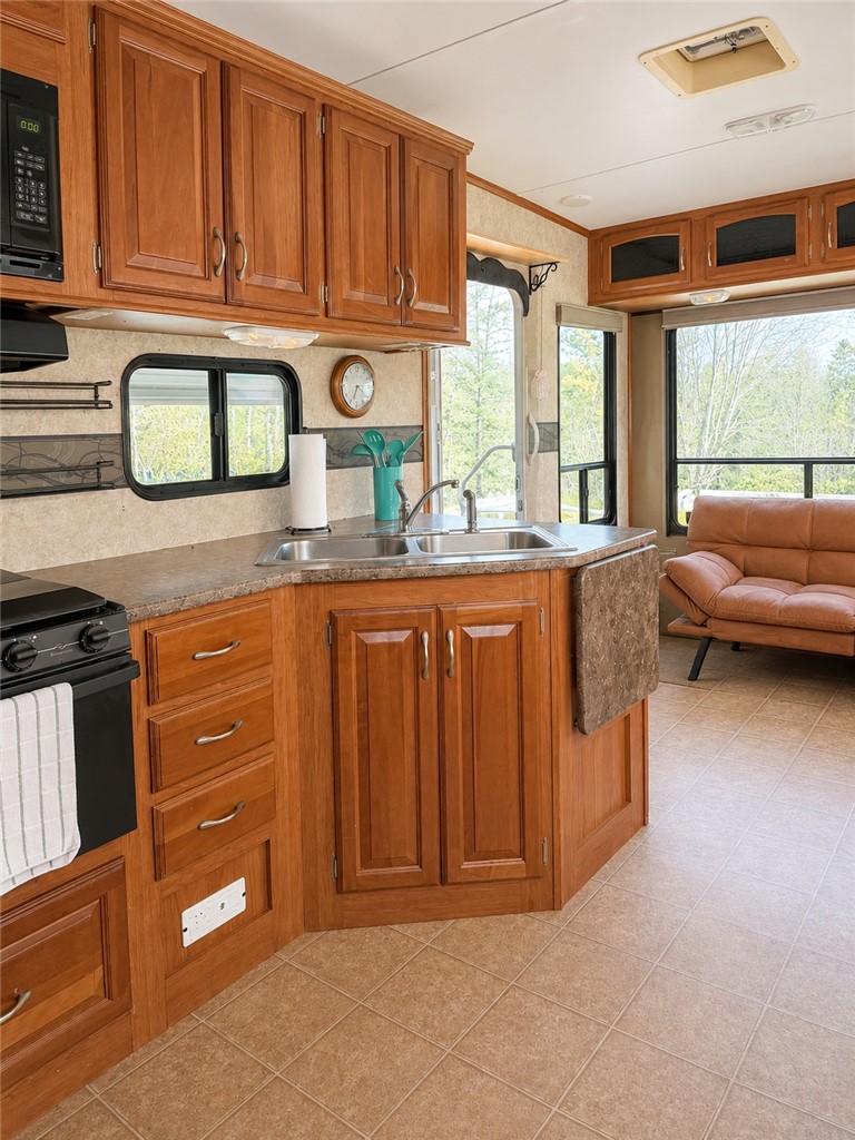 208 Reston Way Westminster, SC 29693 - Photo 3 of 26 This functional kitchen provides a compact, yet complete, culinary space with ample cabinetry.