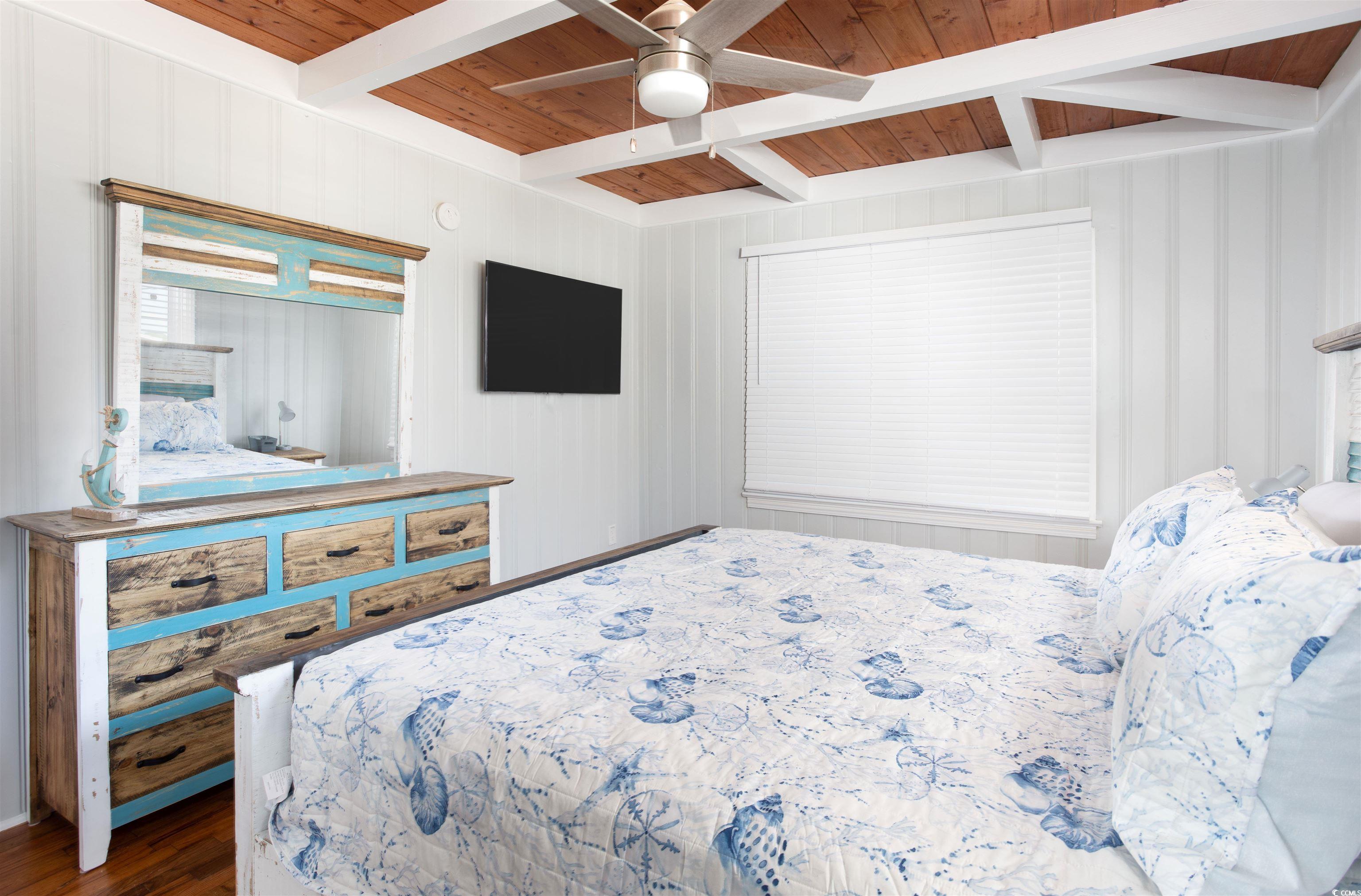 214 Yucca Avenue Murrells Inlet, SC 29576 - Photo 13 of 22 Bedroom featuring a wood ceiling with exposed beams, ceiling fan, and wood finished floors