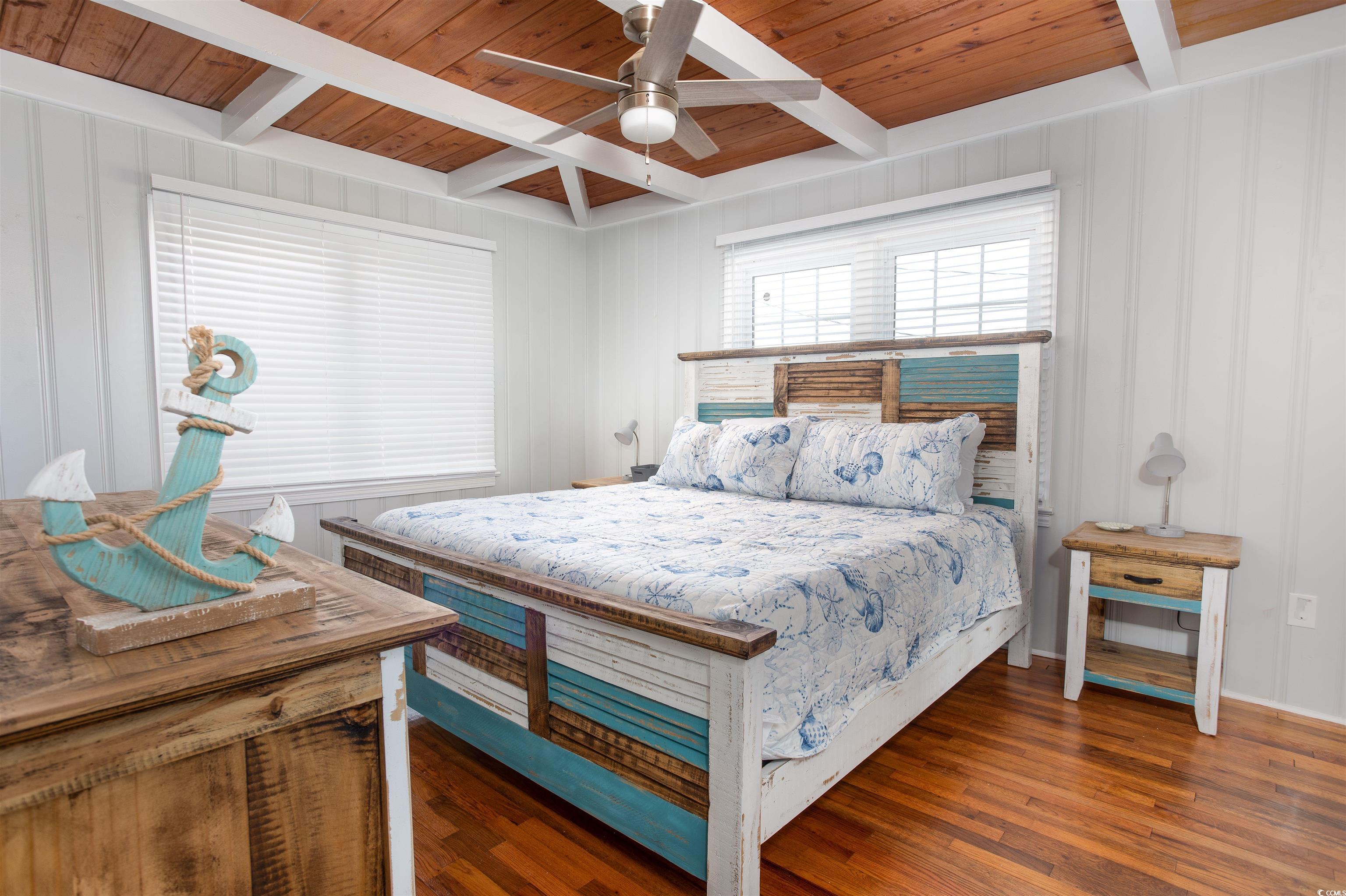 214 Yucca Avenue Murrells Inlet, SC 29576 - Photo 14 of 22 Bedroom featuring a wood ceiling with exposed beams, dark wood finished floors, and ceiling fan