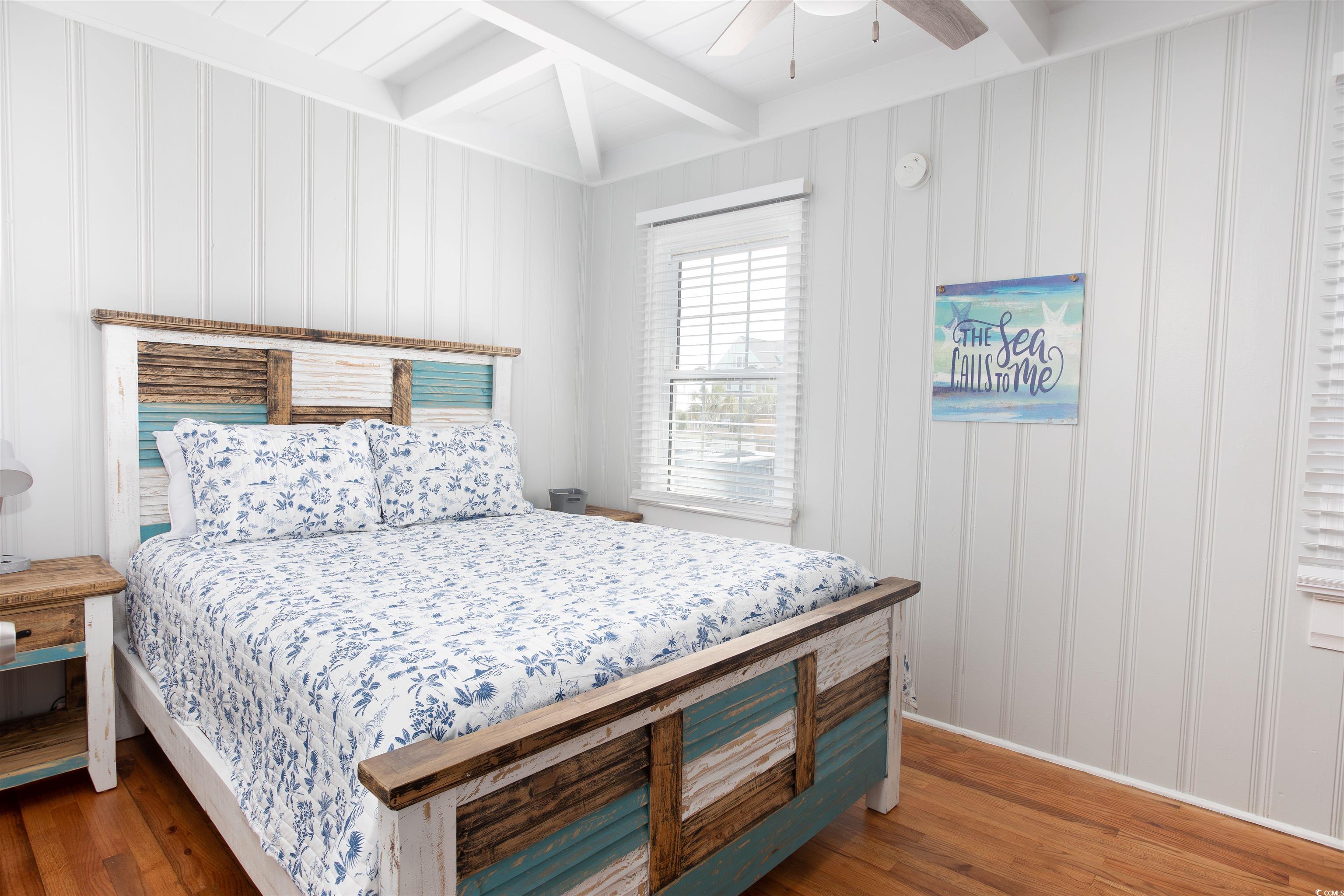 214 Yucca Avenue Murrells Inlet, SC 29576 - Photo 18 of 22 Bedroom with wood finished floors, beam ceiling, and ceiling fan