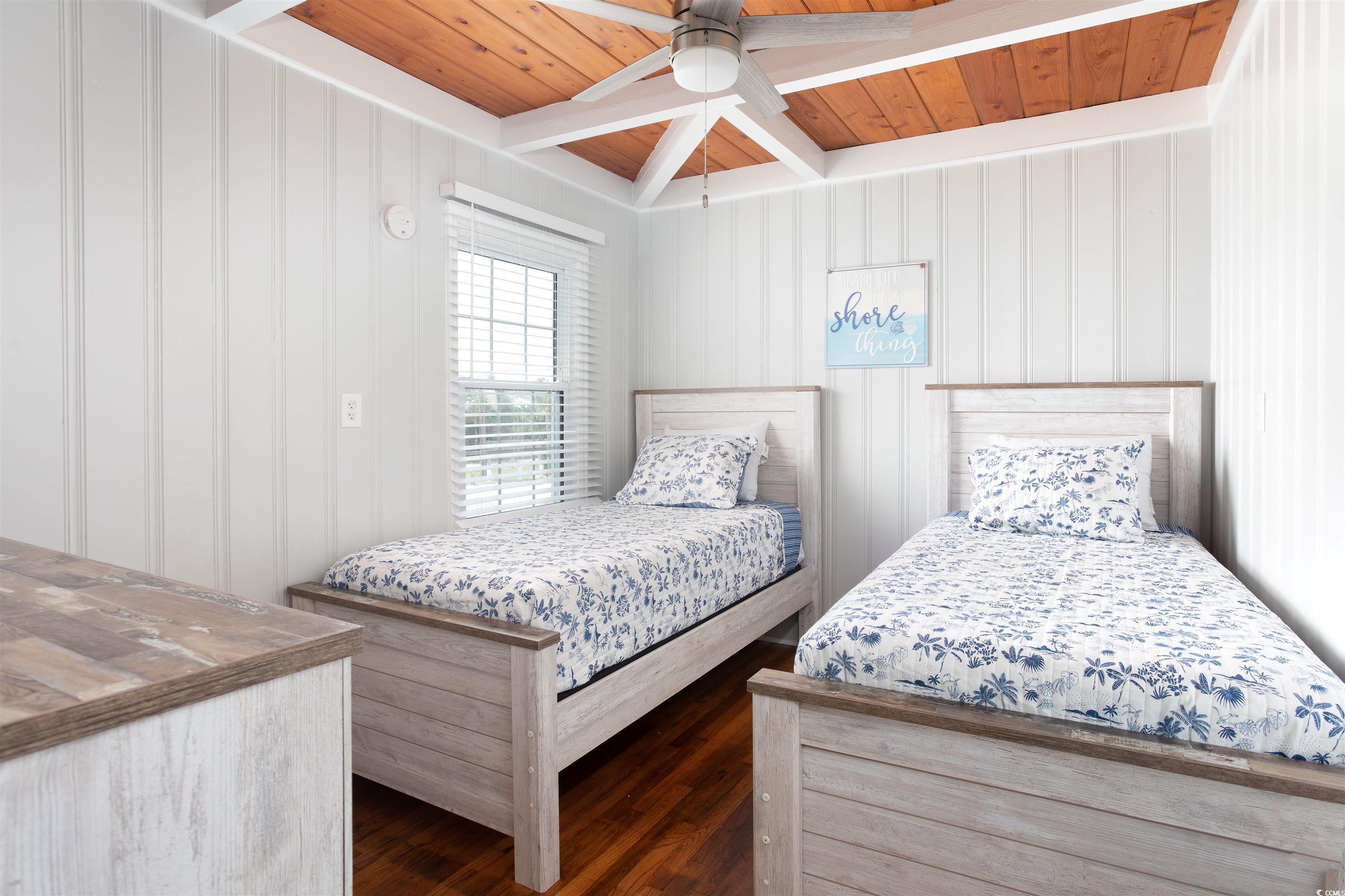 214 Yucca Avenue Murrells Inlet, SC 29576 - Photo 21 of 22 Bedroom featuring a wooden ceiling with exposed beams, ceiling fan, and dark wood-style floors