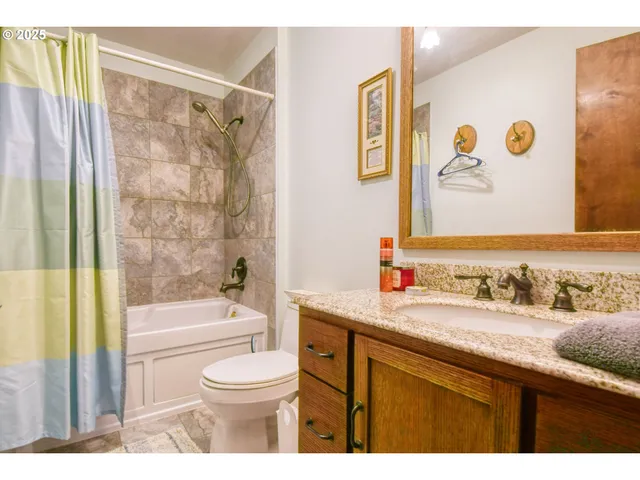 a bathroom with a sink a toilet and a bathtub