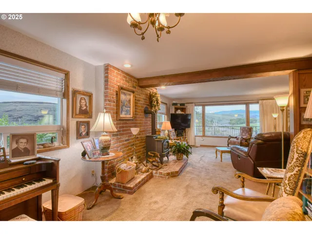 a living room with furniture and large windows