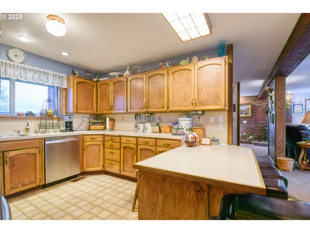 a kitchen with sink a stove and cabinets