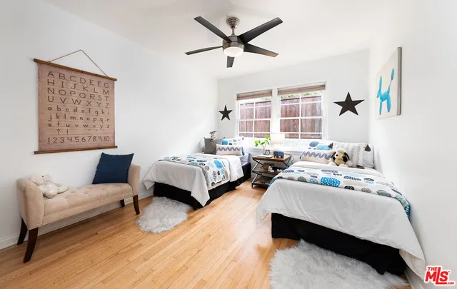 a bedroom with bed and a window