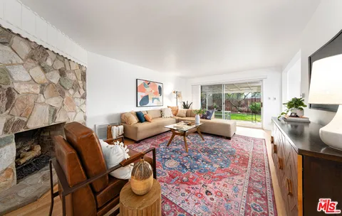 a living room with furniture and a rug