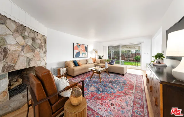 a living room with furniture and a rug