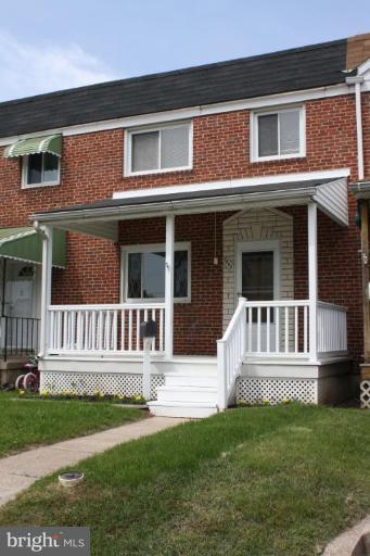7866 Kavanagh Road Dundalk, MD 21222 - Photo 1 of 14 a view of a house with a deck and a yard