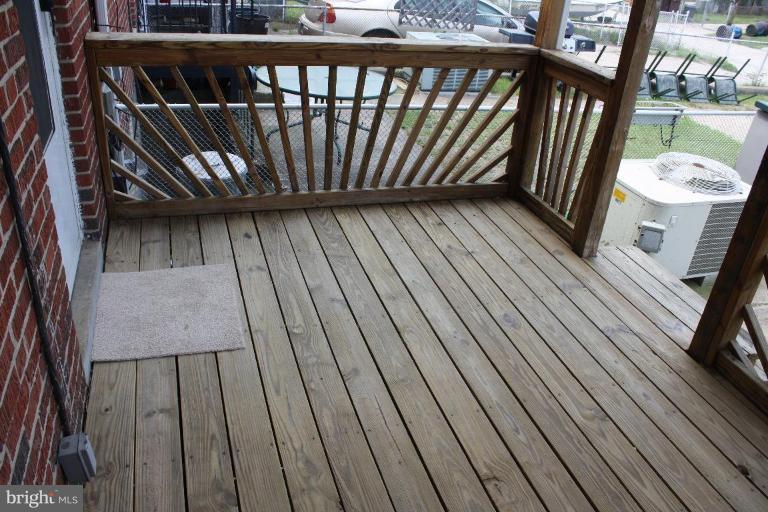 7866 Kavanagh Road Dundalk, MD 21222 - Photo 3 of 14 a view of balcony with wooden floor