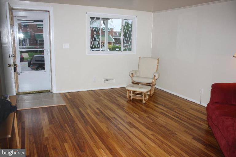 7866 Kavanagh Road Dundalk, MD 21222 - Photo 6 of 14 a view of a room with wooden floor and a window