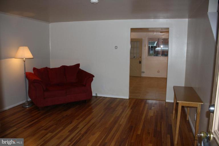 7866 Kavanagh Road Dundalk, MD 21222 - Photo 7 of 14 a living room with furniture and a wooden floor