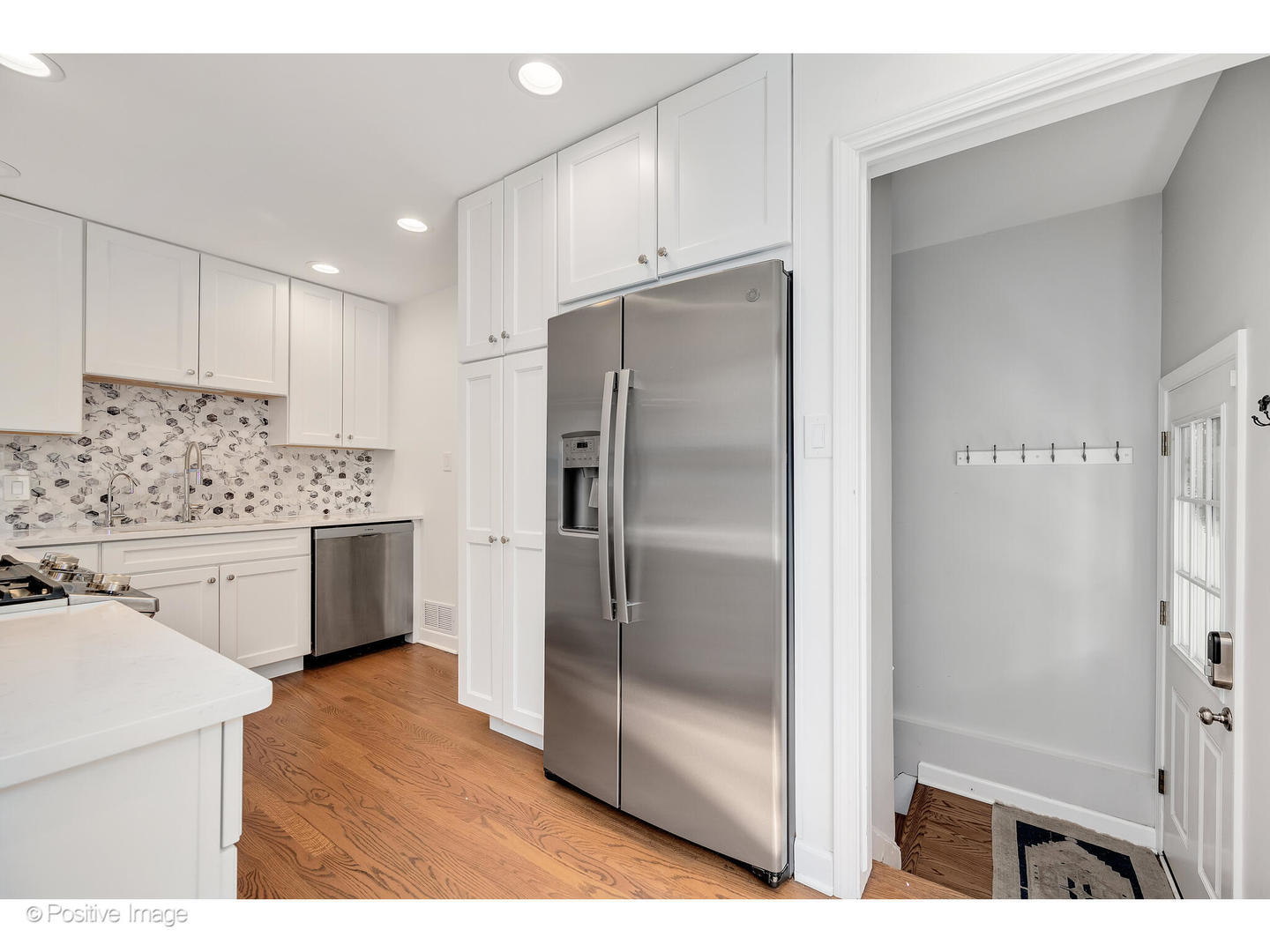 4101 Linden Avenue Western Springs, IL 60558 - Photo 11 of 29 a kitchen with stainless steel appliances a refrigerator sink and cabinets