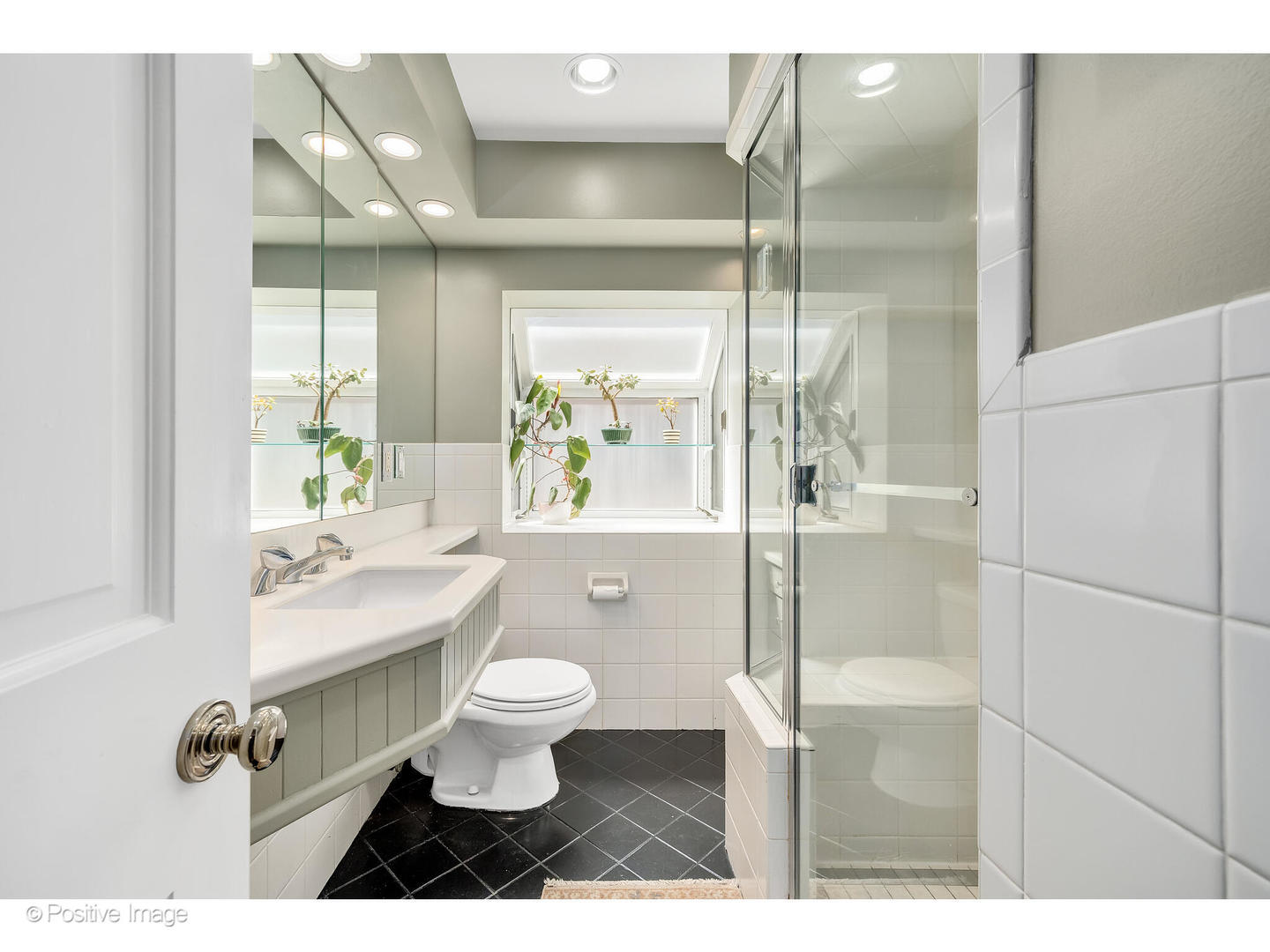 4101 Linden Avenue Western Springs, IL 60558 - Photo 13 of 29 a bathroom with a sink toilet a mirror and shower