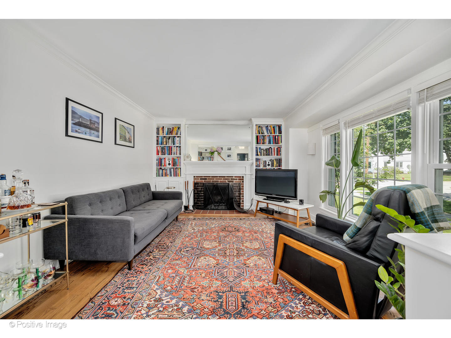 4101 Linden Avenue Western Springs, IL 60558 - Photo 4 of 29 a living room with furniture a flat screen tv and a fireplace