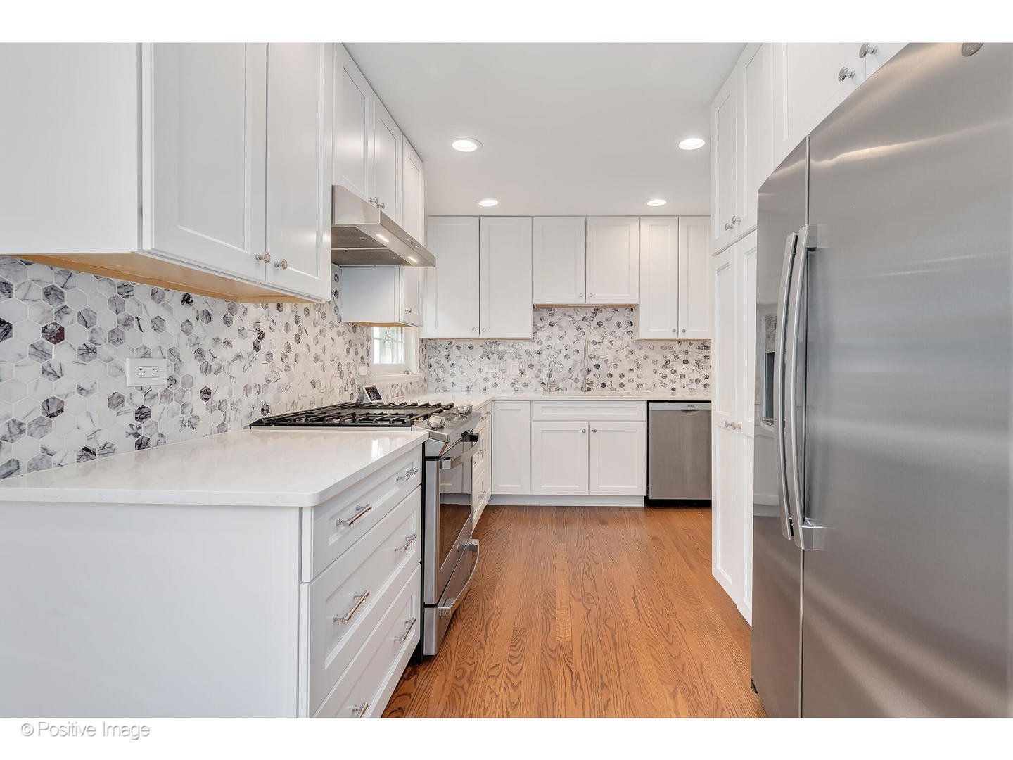 4101 Linden Avenue Western Springs, IL 60558 - Photo 10 of 29 a kitchen with kitchen island a sink stainless steel appliances and cabinets