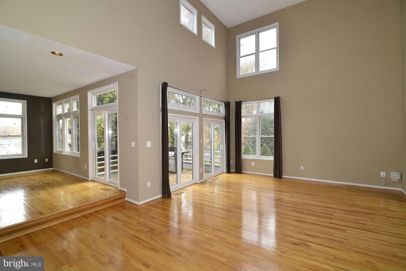 2040 Beacon Place Reston, VA 20191 - Photo 15 of 30 a view of an empty room with window and wooden floor
