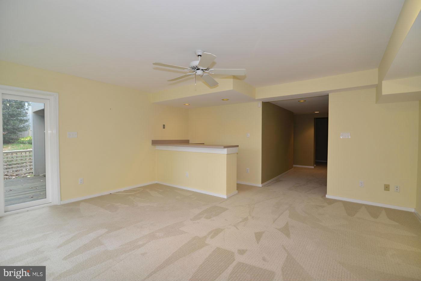 2040 Beacon Place Reston, VA 20191 - Photo 20 of 30 an empty room with a ceiling fan and a bathroom