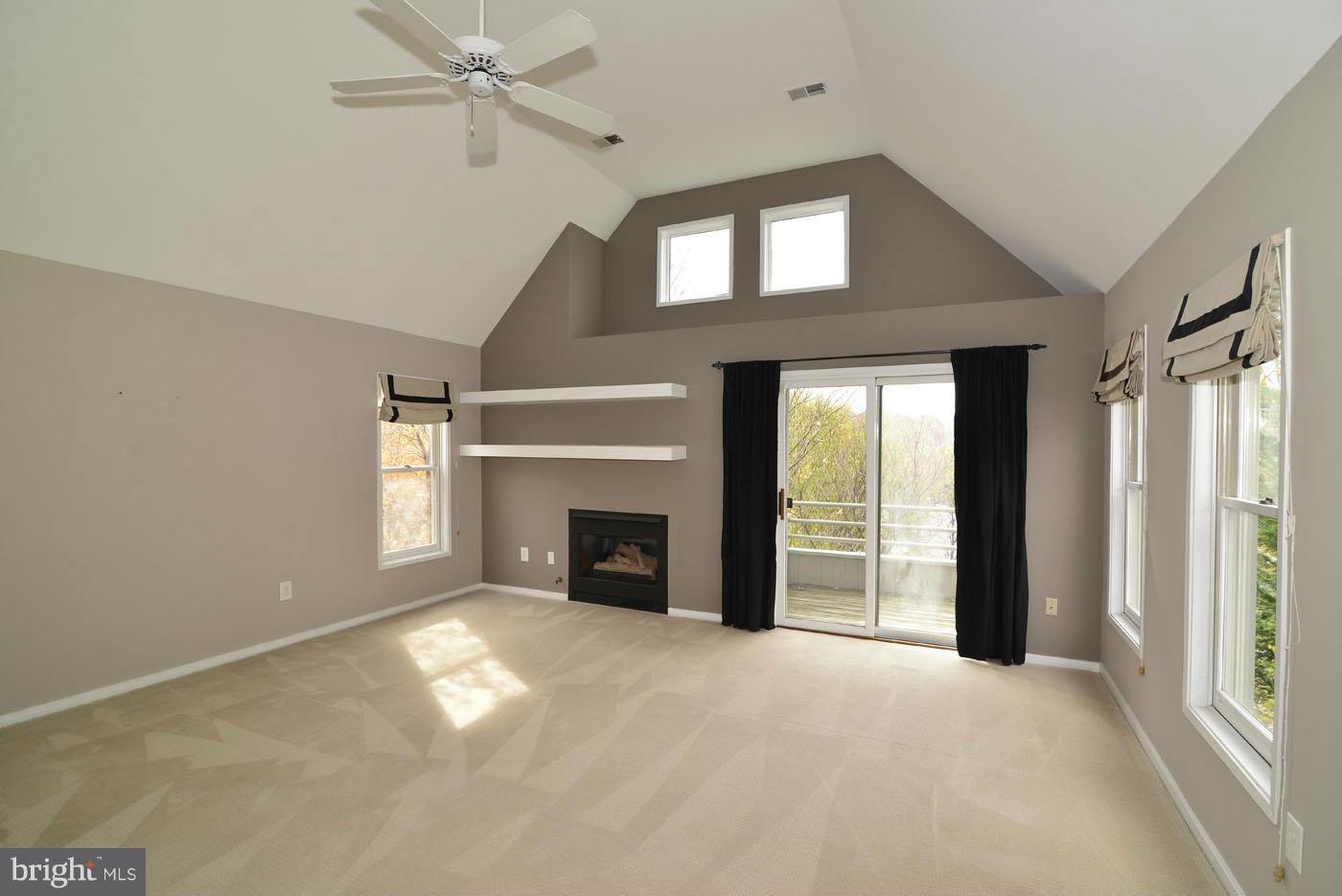 2040 Beacon Place Reston, VA 20191 - Photo 24 of 30 an empty room with windows and fireplace