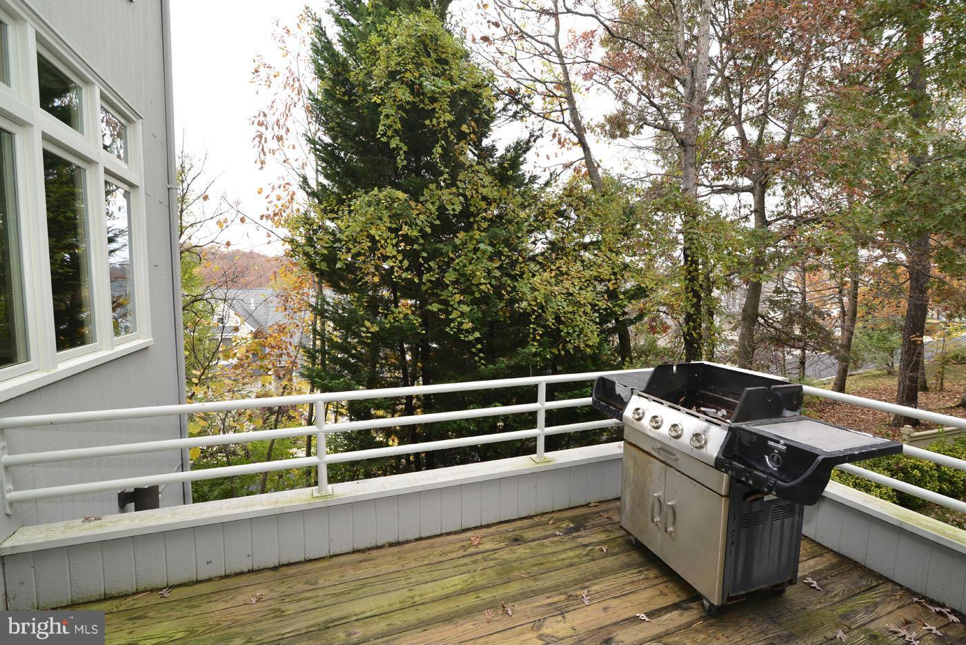 2040 Beacon Place Reston, VA 20191 - Photo 6 of 30 a view of a roof deck with couches and wooden floor