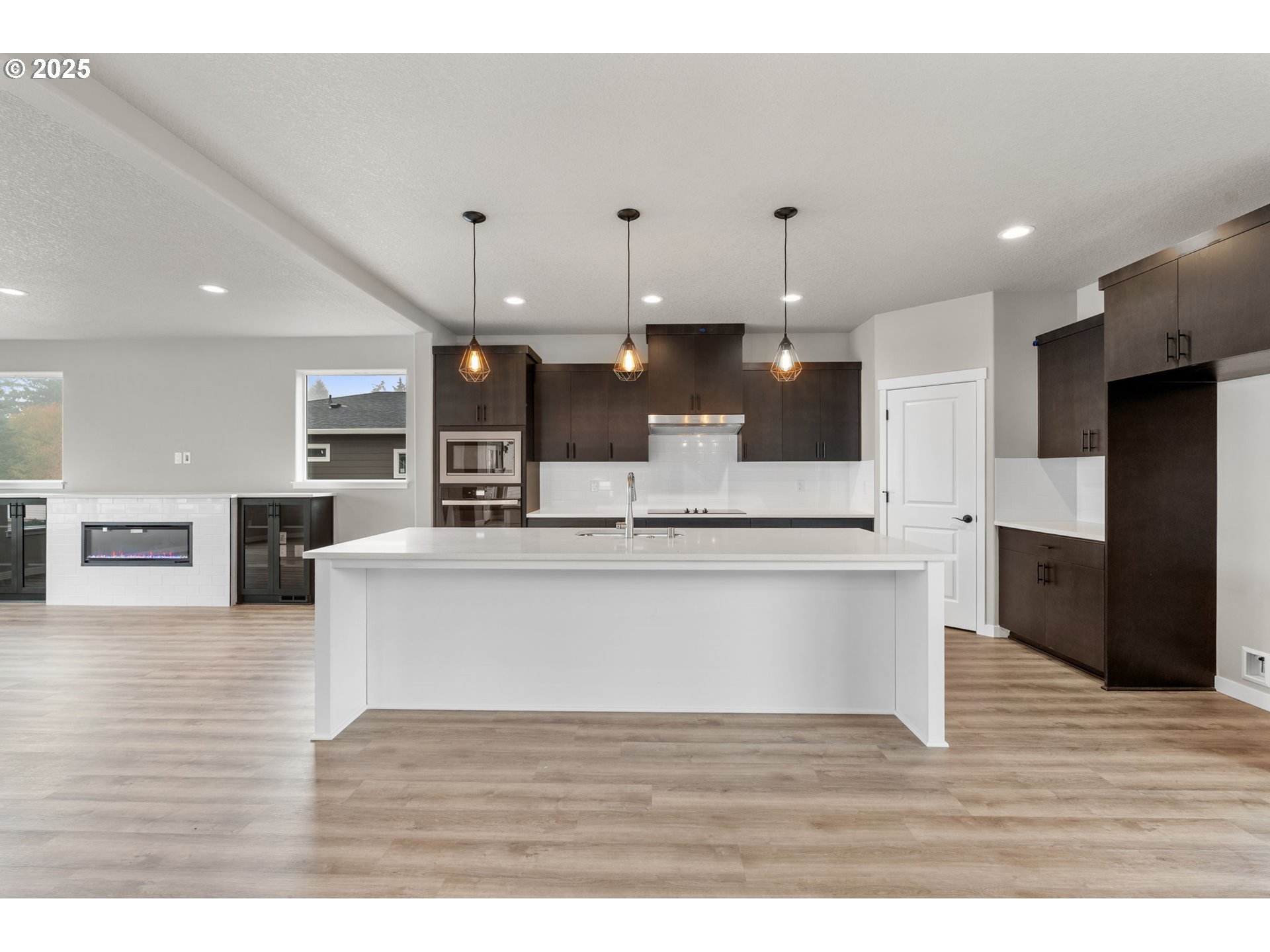 1105 Northwest 111th Circle Vancouver, WA 98685 - Photo 14 of 48 a view of kitchen with kitchen island microwave and refrigerator
