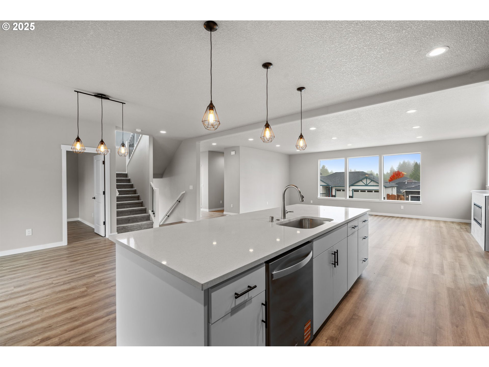 1105 Northwest 111th Circle Vancouver, WA 98685 - Photo 16 of 48 a kitchen with a sink a stove and a wooden floor