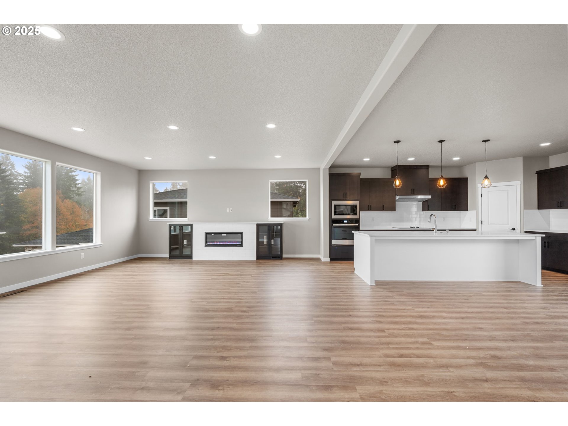 1105 Northwest 111th Circle Vancouver, WA 98685 - Photo 17 of 48 a view of kitchen with kitchen island a stove and wooden floor