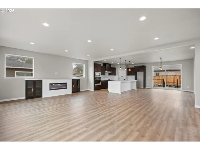 a view of kitchen with stainless steel appliances kitchen island