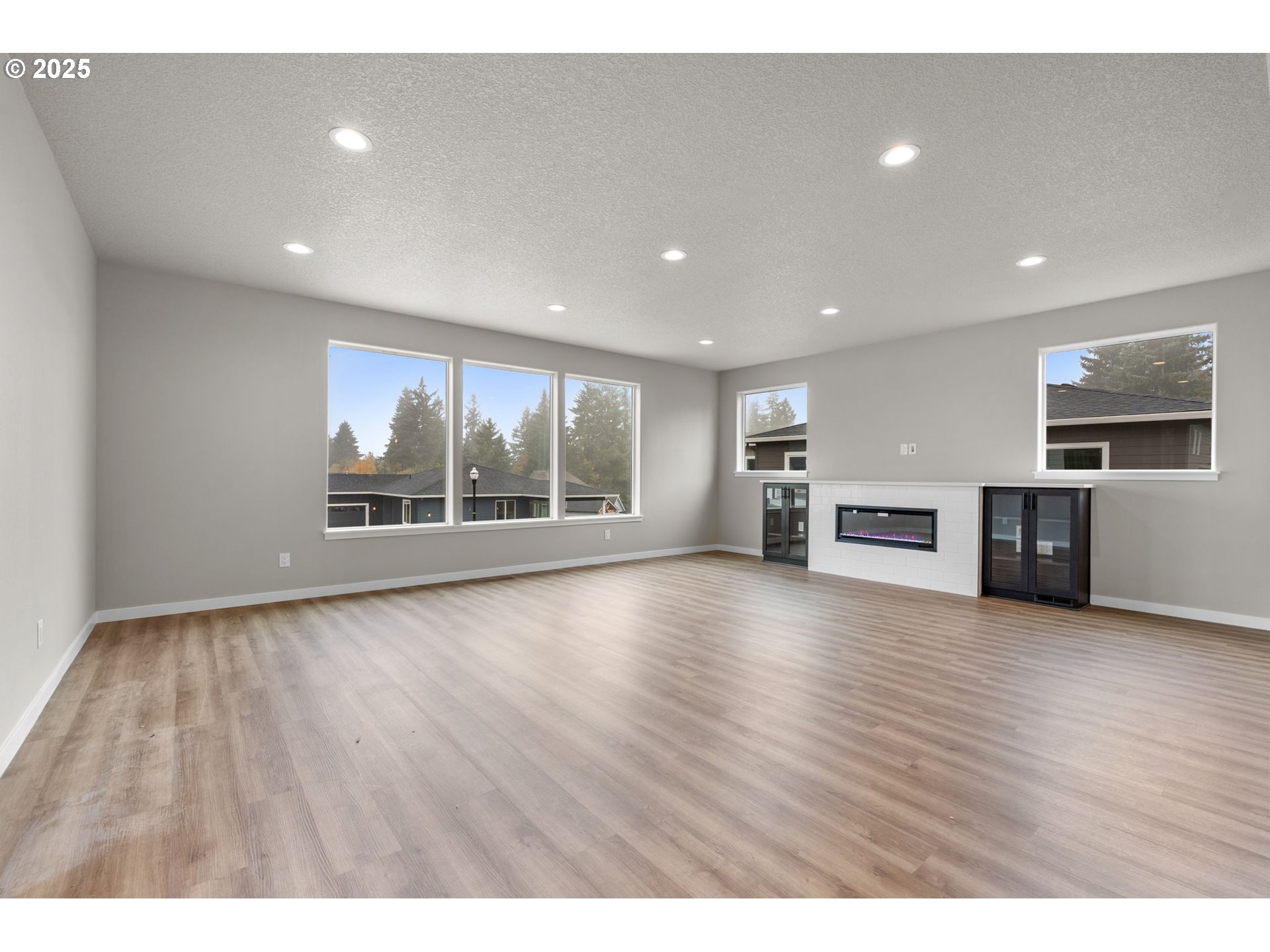 1105 Northwest 111th Circle Vancouver, WA 98685 - Photo 21 of 48 a view of empty room with kitchen and fireplace