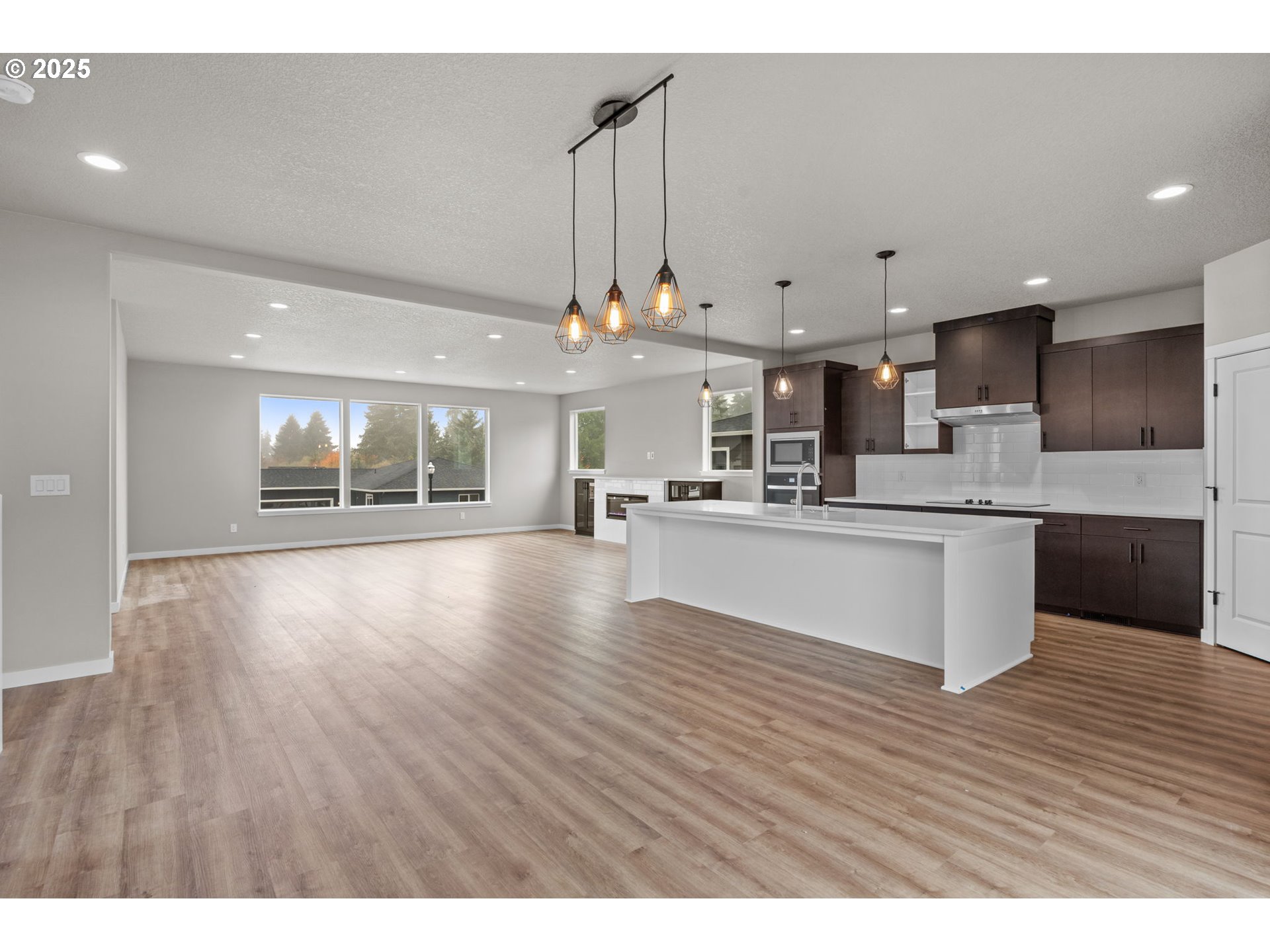 1105 Northwest 111th Circle Vancouver, WA 98685 - Photo 23 of 48 a large white kitchen with kitchen island a sink stainless steel appliances and cabinets