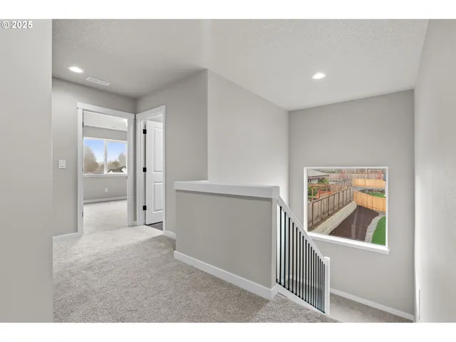 a view of a livingroom with a ceiling fan and window