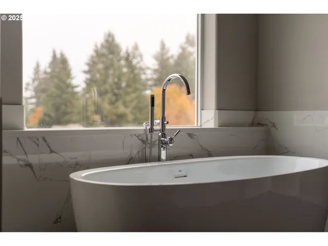 a bathroom with a double vanity sink and mirror