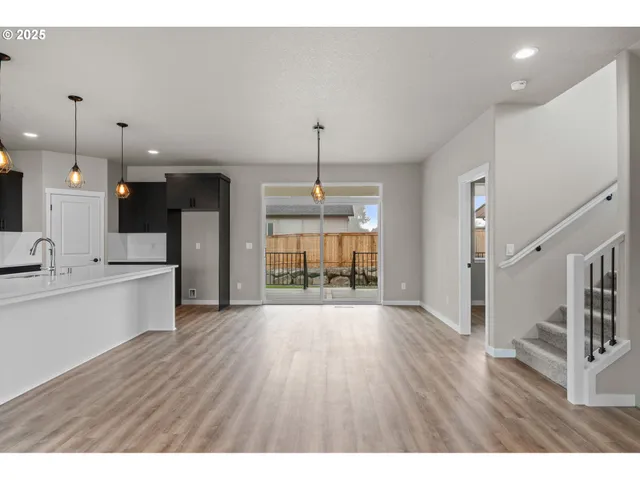 a view of kitchen with furniture and wooden floor