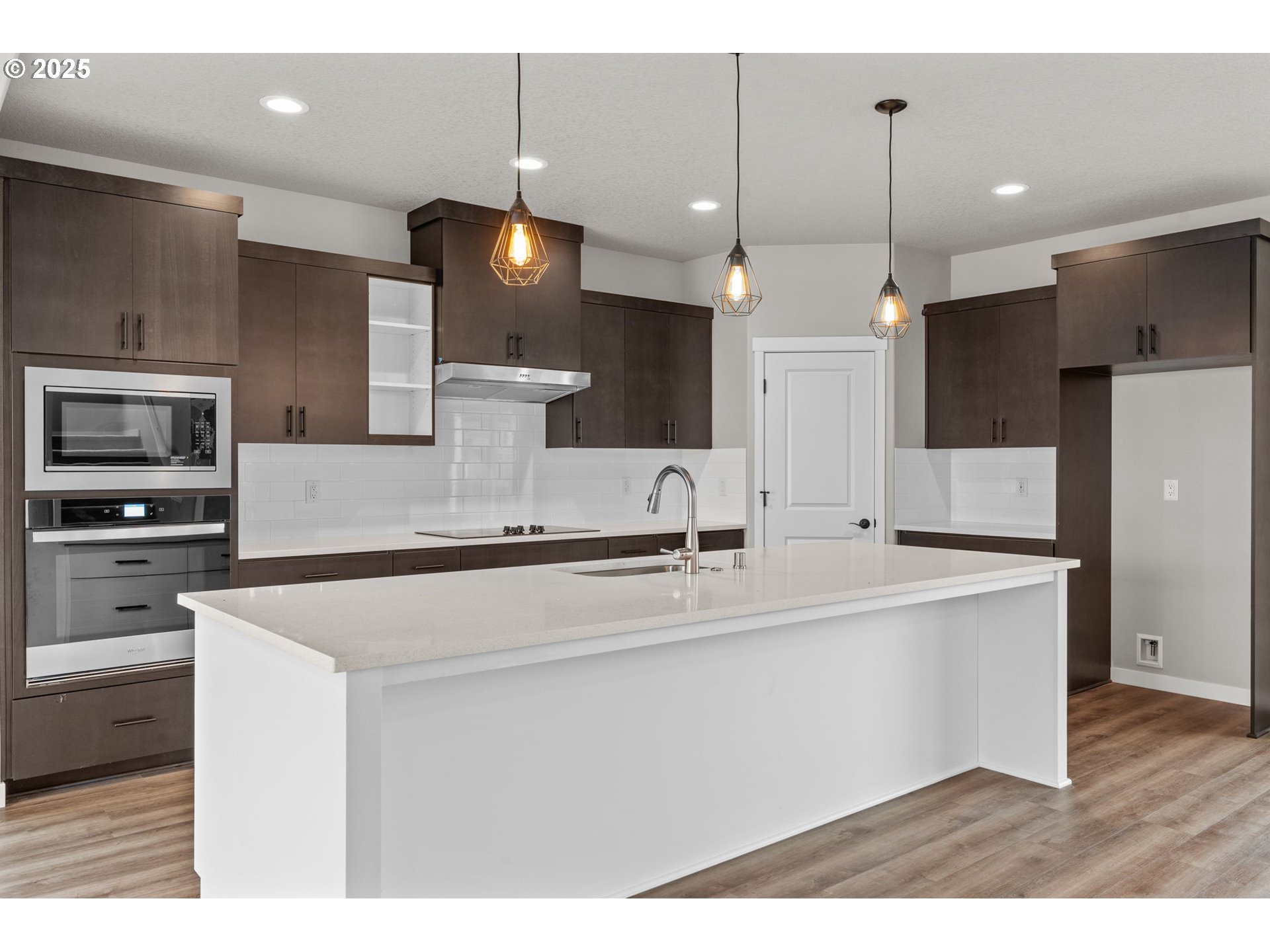 1105 Northwest 111th Circle Vancouver, WA 98685 - Photo 9 of 48 a large kitchen with a large counter top a sink stainless steel appliances and cabinets