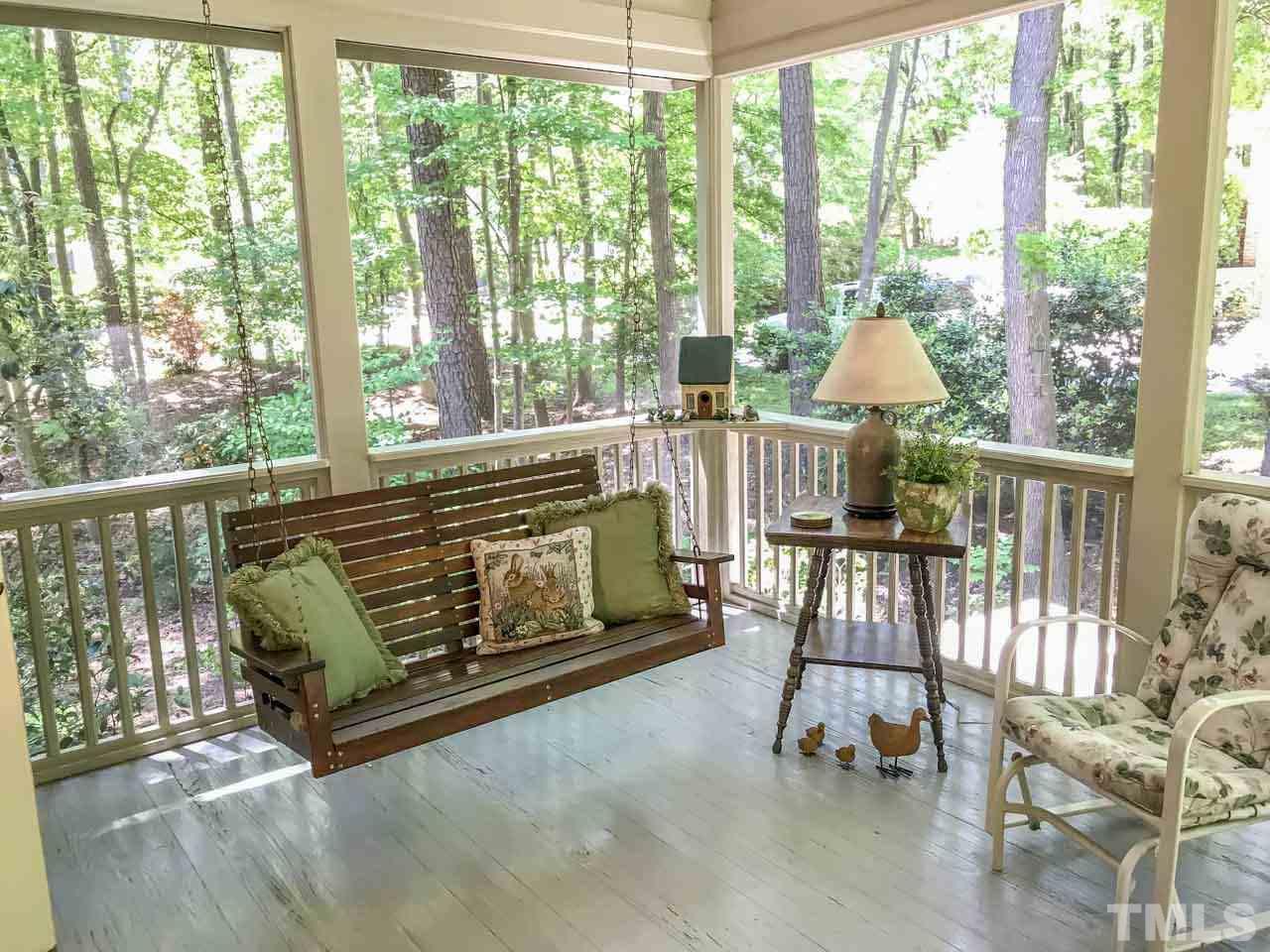 1806 Grande Oaks Road Durham, NC 27712 - Photo 12 of 25 a living room with furniture and a floor to ceiling window