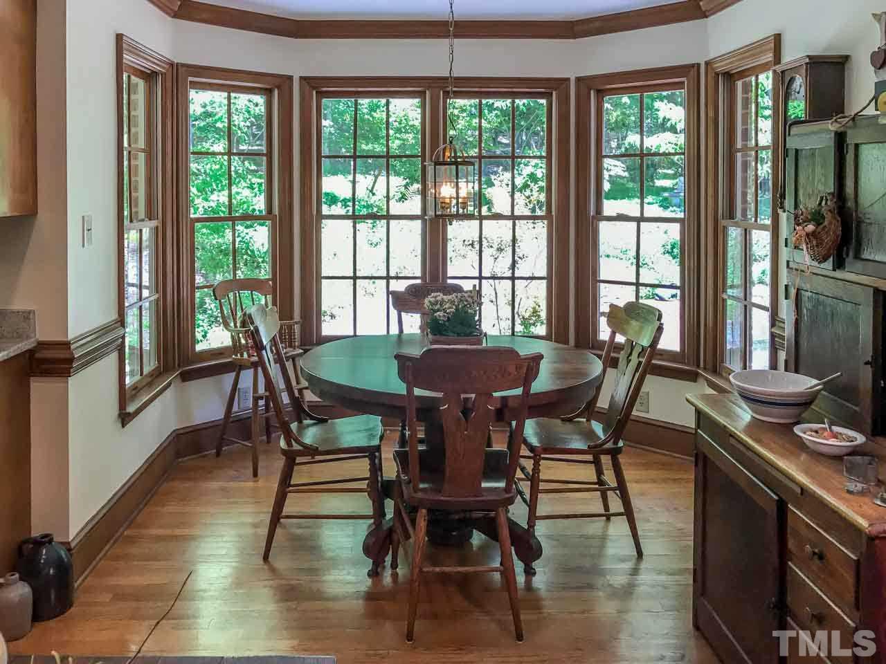 1806 Grande Oaks Road Durham, NC 27712 - Photo 16 of 25 a view of a dining room with furniture window and outside view