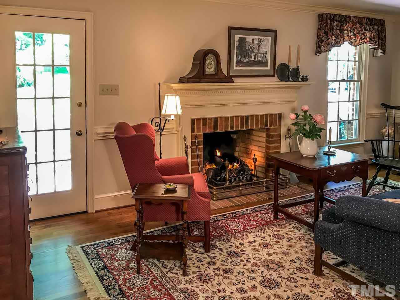 1806 Grande Oaks Road Durham, NC 27712 - Photo 17 of 25 a living room with furniture and a fireplace