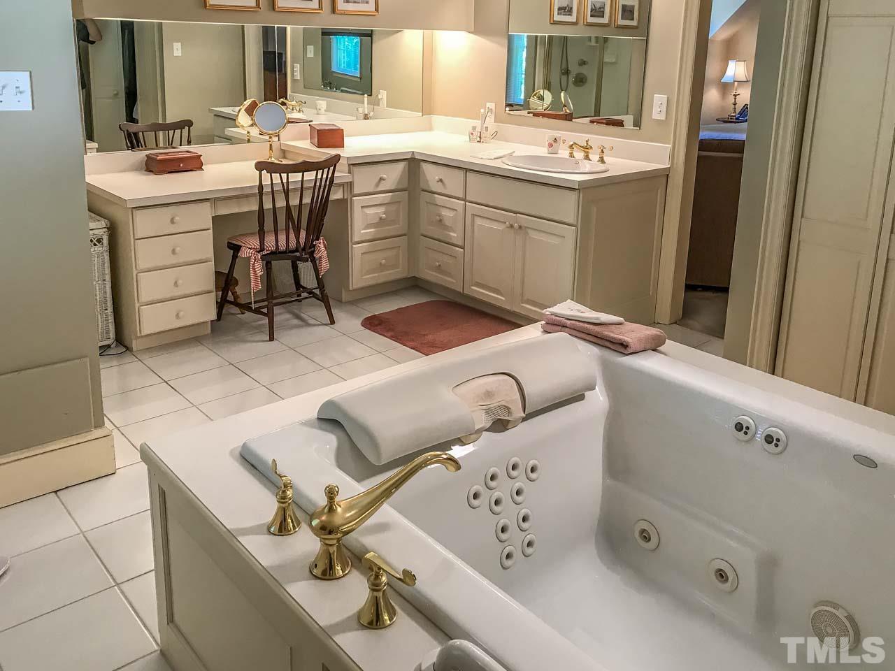 1806 Grande Oaks Road Durham, NC 27712 - Photo 23 of 25 a room with a sink and a window