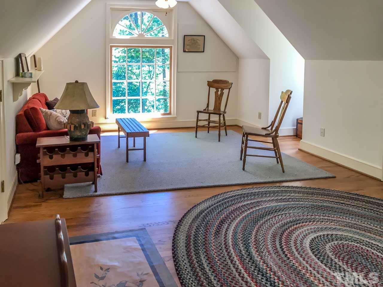 1806 Grande Oaks Road Durham, NC 27712 - Photo 25 of 25 a living room with furniture and a window