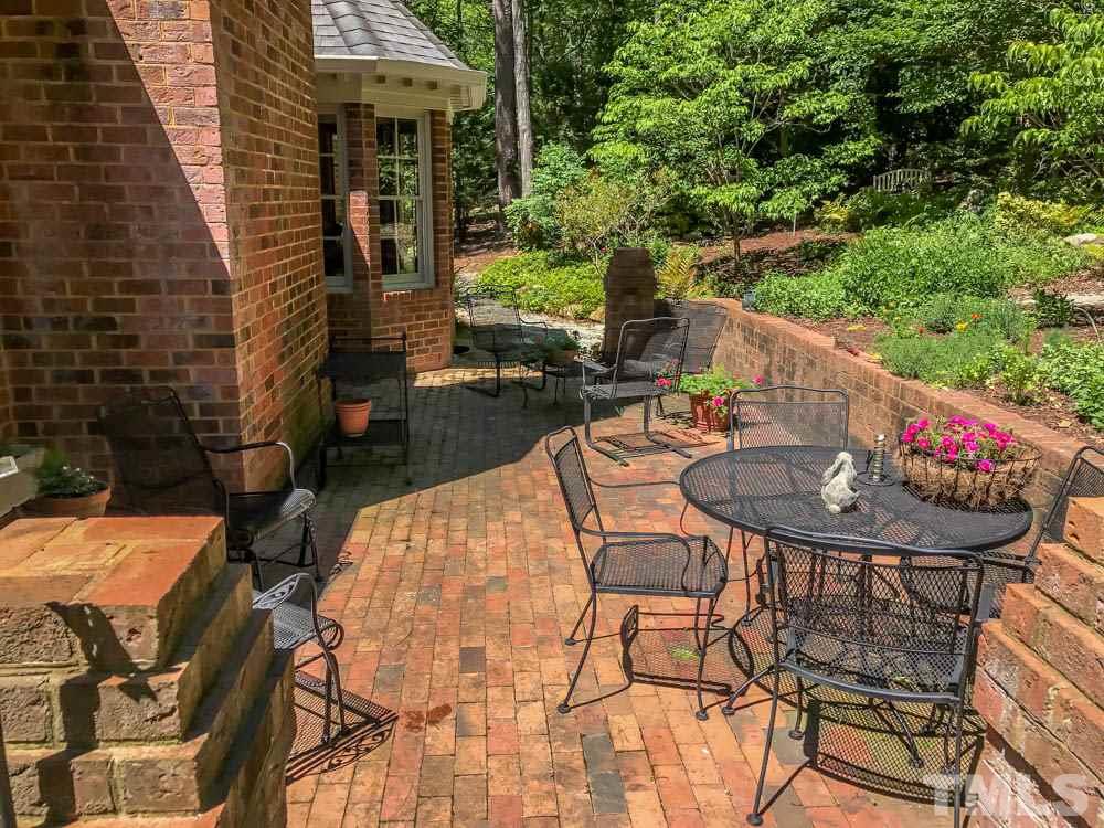 1806 Grande Oaks Road Durham, NC 27712 - Photo 4 of 25 a view of a table and chairs in patio