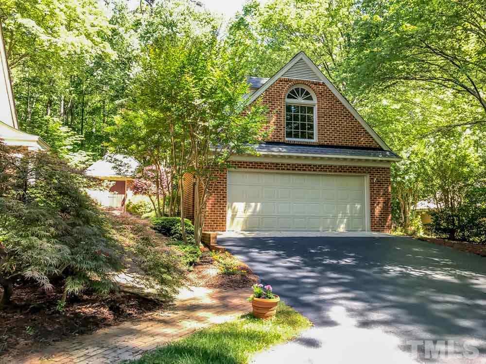 1806 Grande Oaks Road Durham, NC 27712 - Photo 5 of 25 a front view of a house with a yard and garage