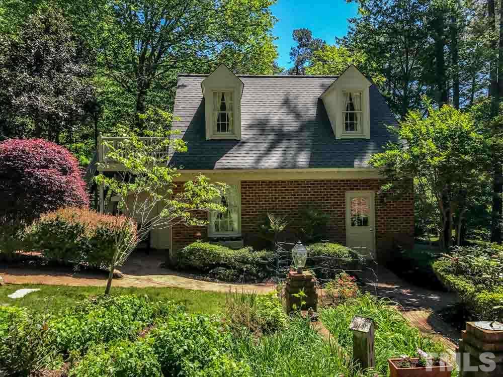 1806 Grande Oaks Road Durham, NC 27712 - Photo 6 of 25 a view of a house with a yard and garden