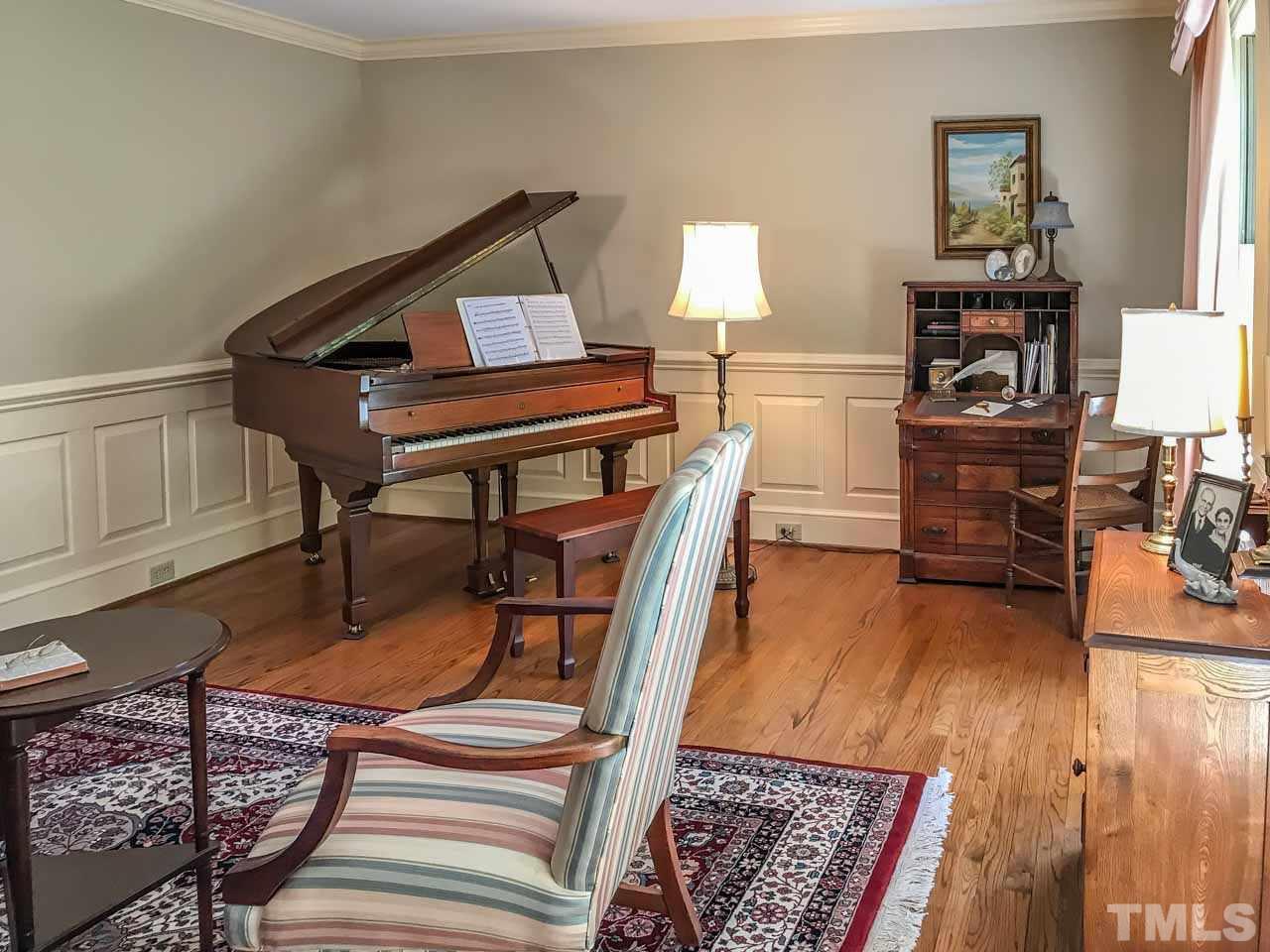 1806 Grande Oaks Road Durham, NC 27712 - Photo 10 of 25 a living room with furniture and wooden floor